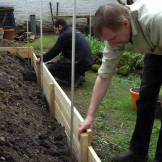 Allan helping to build a raised bed