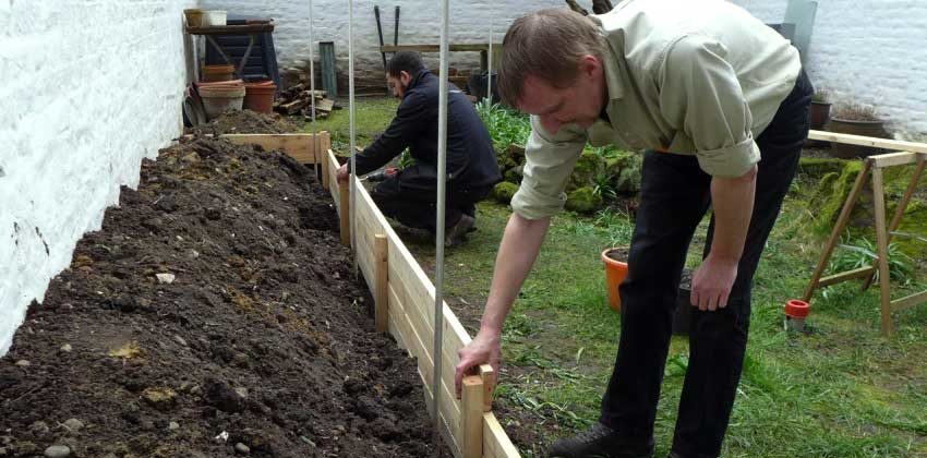 Allan helping to build a raised bed
